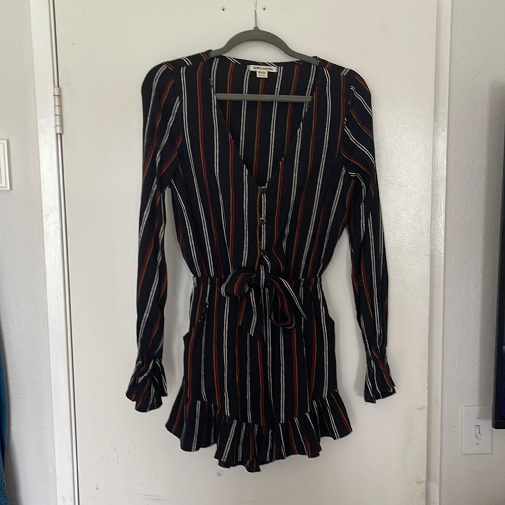 One piece romper button front w/tie, ruffle on hemline and cuffs